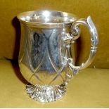 A VERY FINE 19TH CENTURY SILVER TANKARD, with intricate detail, having scroll handle and foliage