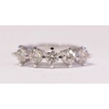 AN 18CT WHITE GOLD 5 STONE DIAMOND RING, in an elevated claw setting, diamond weight 1.65cts, ring