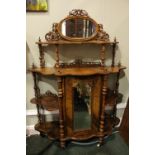 A VERY FINE VICTORIAN ‘WHAT-NOT’, a four tier what not, with oval mirror to the top tier, and a