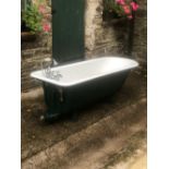 A ROLL TOP VICTORIAN CAST IRON FREE STANDING BATH, with taps and shower head, 27in x 72in x 25in