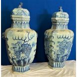 A PAIR OF BLUE & WHITE CHINESE VAES with lids, 68cm tall approx