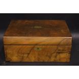 A LATE 19TH CENTURY WRITING BOX, with brass cartouche & key plate, opens to reveal velvet covered