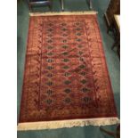 A GOOD BOKHARA RUG, wool, with multiple borders having geometric pattern, with repeat pattern to the