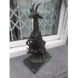 A PAIR OF BRONZE GAZELLES on marble bases, 30in high