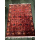 A VERY FINE PERSIAN TORKAMAN SILK RUG main ground red, with deep blue small gull medallions to the