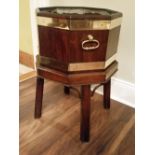A GOOD QUALITY 19TH CENTURY BRASS BOUND MAHOGANY WINE COOLER, hexagonal shaped, on a fixed stand