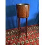 A MAHOGANY INLAID PLANT STAND, cylindrical form, with tapered splayed inlaid legs united by a