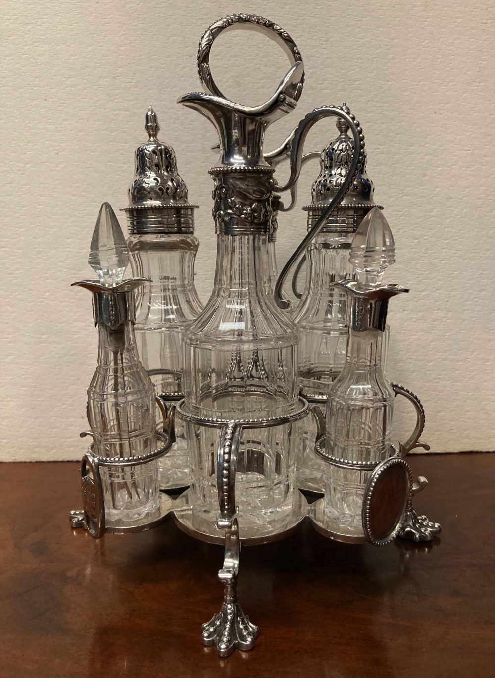 A 19TH CENTURY SILVER PLATED 8 BOTTLE CRUET SET, raised on four claw feet, c.1870, 10" high - Image 2 of 4