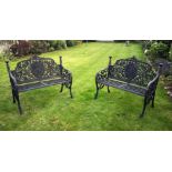 A PAIR OF CAST IRON TWO SEATER GARDEN BENCHES with classical  female decoration , 42in wide