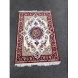 A PERSIAN ‘ESFEHAN’ HAND KNOTTED RUG, with 16th century Shah Abbas design, having a woollen pile and