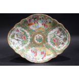 A FAMILLE ROSE SERVING DISH, decorated with panels of people and birds, probably 19th Century, 11" /