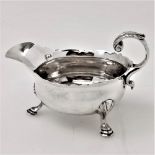 A MID 18TH CENTURY SILVER GRAVY BOAT, London, 1752, by John Pollock, with plain body having