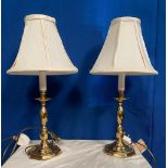A PAIR OF BRASS 'CANDLE STICK' TABLE LAMPS with shades, electric