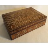 AN INDIAN SANDLE WOOD BOX with inlaid bone, mother of pearl, exotic timbers and straw in geometric