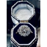 AN 18CT YELLOW & WHITE GOLD ANTIQUE DIAMOND DAISY CLUSTER RING, with centre diamond 1.20cts and