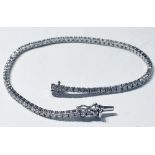 A STUNNING 18CT WHITE GOLD DIAMOND TENNIS BRACELET, 1.70cts diamonds, with safety catch, in