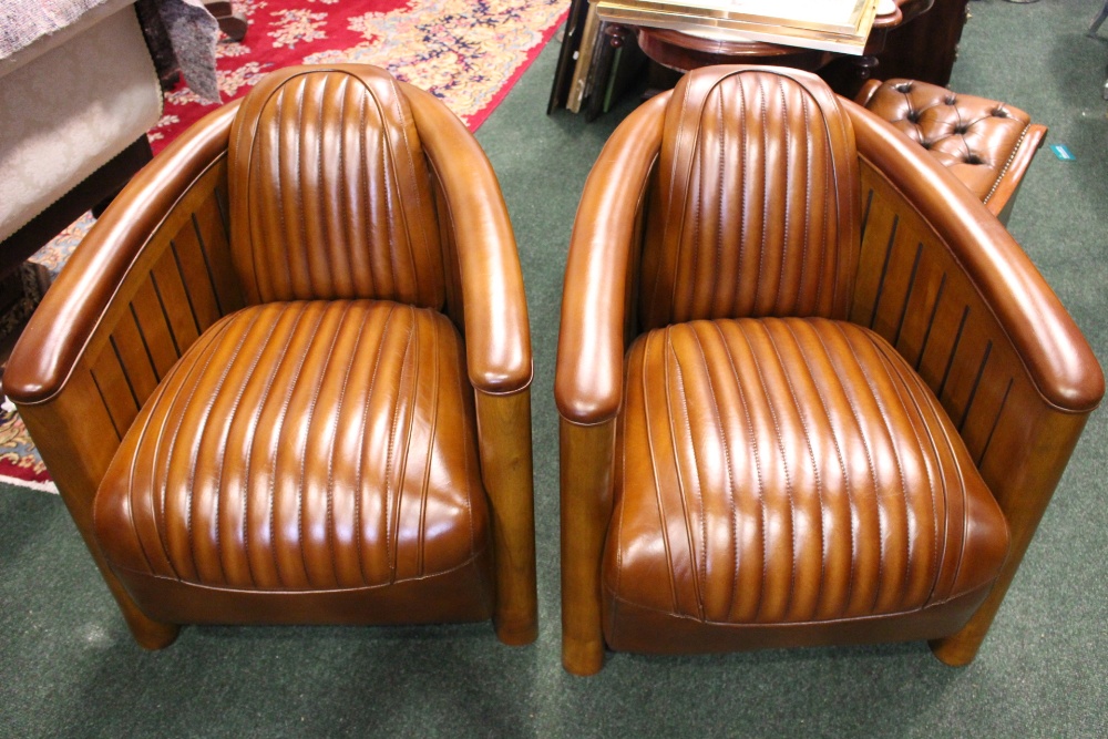A PAIR OF AVIATOR CLUB ARMCHAIRS, with leather seats in a wooden frame, with ebonised fluted