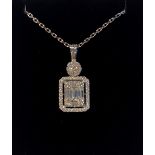 A FANTASTIC 18CT WHITE GOLD BAGUETTE AND ROUND BRILLIANT CUT DIAMOND PENDANT, with 18 inch white