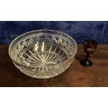 A GEORGIAN CUT GLASS BOWL c.1830 ALONG WITH A VICTORIAN BOHEMIAN RED OVERLAY CORDIAL GLASS c.1840,