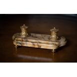 A 19TH CENTURY FRENCH ORMOLU AND MARBLE INKWELL, 30cm long
