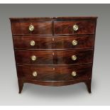 A VERY FINE GEORGIAN FIGURED MAHOGANY BOW FRONTED CHEST OF DRAWERS, circa 1800, with crossbanded and