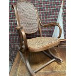 AN EARLY 20TH CENTURY BENTWOOD ROCKING CHAIR
