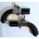 A PAIR OF MID 19TH CENTURY IRISH TURN OVER PERCUSSION CAP PISTOLS, turning on a central pivot