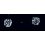 A PAIR OF 18CT WHITE GOLD DIAMOND STUD EARRINGS, the diamonds are claw set and weigh 1.04 cts,