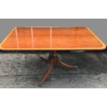 A TIP UP BREAKFAST / DINNING TABLE, Dooly & Sons, raised on reeded tri pod base on castors