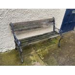 AN EARLY 20TH CENTURY CAST IRON GARDEN SEAT, in need of restoration, 145cm wide