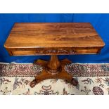 A FINE WILLIAM IV ROSEWOOD FOLD OVER CARD TABLE with cross banded edge, curved front corners, carved