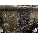 AN UNUSUAL BRASS STUDDED AND HARDWOOD LIFT TOP TRUNK, with three drawers and carrying handles