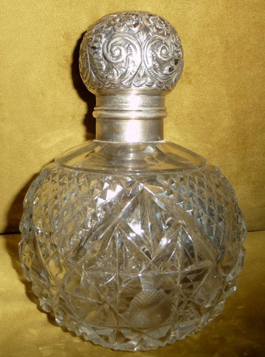 A LARGE EARLY 20TH CENTURY CUT GLASS PERFUME BOTTLE, with silver top and collar, the top opens to - Image 2 of 2