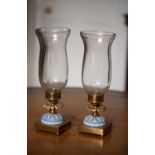 A PAIR OF ORMOLU AND WEDGEWOOD CANDLESTICKS WITH STORM SHADES, designed and created by Philip