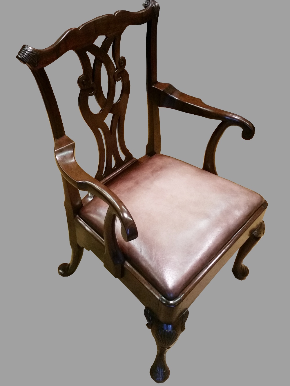 A RARE & WONDERFUL 18TH CENTURY IRISH CARVED MAHOGANY ARMCHAIR, with a shaped crest rail having