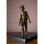 A 19TH CENTURY BRONZE OF THE ARTFUL DODGER, 24cm high (26cm on base)