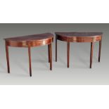 A PAIR OF GOOD QUALITY GEORGIAN 18TH CENTURY MAHOGANY DEMI LUNE TABLES, circa 1780, raised on reeded