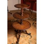 A GEORGE III MAHOGANY THREE TIER DUMB WAITER, on tripod cabriole leg base, 104cm high,