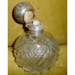A LARGE EARLY 20TH CENTURY CUT GLASS PERFUME BOTTLE, with silver top and collar, the top opens to