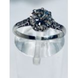 AN 18CT WHITE GOLD DIAMOND SOLITAIRE RING, with diamond shoulders, the solitaire diamond weighs 1.
