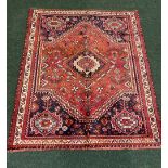 A PERSIAN QUASHQUAI CARPET, Fars Iran, hand woven, with colourful motif and dense weave, knot