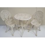 A GOOD QUALITY CAST IRON GARDEN SUITE, includes two chairs and a table, colour: white