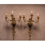 A PAIR OF LARGE BRONZED AND GILDED WALL LIGHTS, 63cm long
