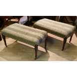 A PAIR OF 19TH CENTURY CARVED MAHOGANY FRAMED LONG STOOLS, or window seats, upholstered seat