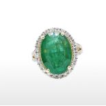 AN 18CT SOLID GOLD EMERALD AND DIAMOND HALO RING, large 5.88ct emerald with round brilliant cut 0.
