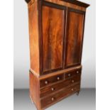 A 19TH CENTURY MAHOGANY TWO DOOR OVER THREE DRAWERS LINEN PRESS on turned leg, with some restoration