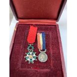 CASED PAIR OF FRENCH MINIATURE MEDALS, (i) A Legion of Honour silver & gilt miniature medal with old