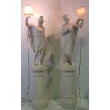 A RARE PAIR OF LARGE 19TH CENTURY PLASTER GREEK FIGURES, each holding a lamp, electrified, each