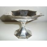 AN EARLY 20TH CENTURY OCTAGONAL SHAPED SILVER TAZZA DISH, with fluted body, raised on pinched column