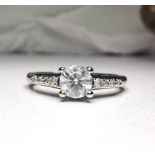 A 18CT WHITE GOLD AND DIAMOND SOLITAIRE RING, round brilliant cut diamond set in the centre of an